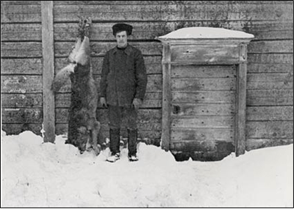 This is not a Russian Wolf. It is a Finnish Wolf. And that is a Finnish Man.